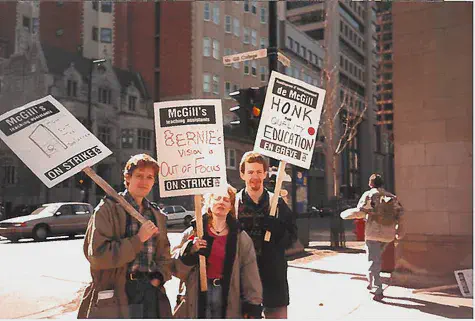 A group of three picketers posing for the camera.